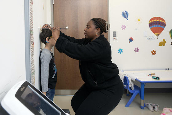 ECHO researcher and child participant. Photo by Evan Cantwell/Office of University Branding.