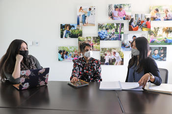 image of three women at a table