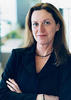 Photo of Marti Kubik with arms crossed